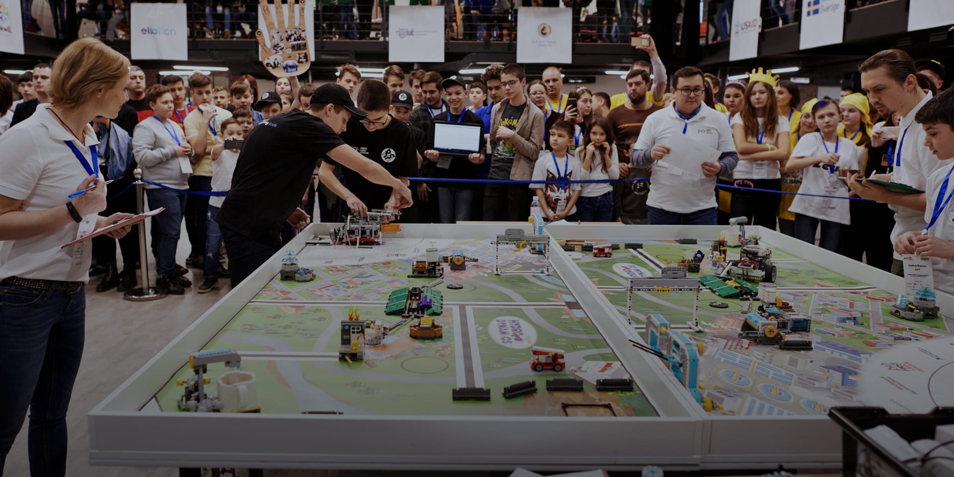 Youth compete in a robotics competition.