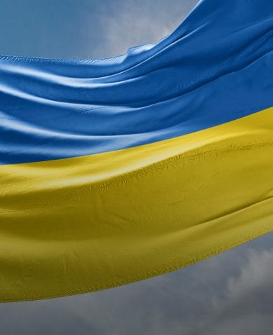 The flag of Ukraine waving on a flagpole.