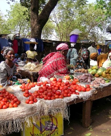 Women sell fruit and vegetables at a market in Sikasso, Mali.