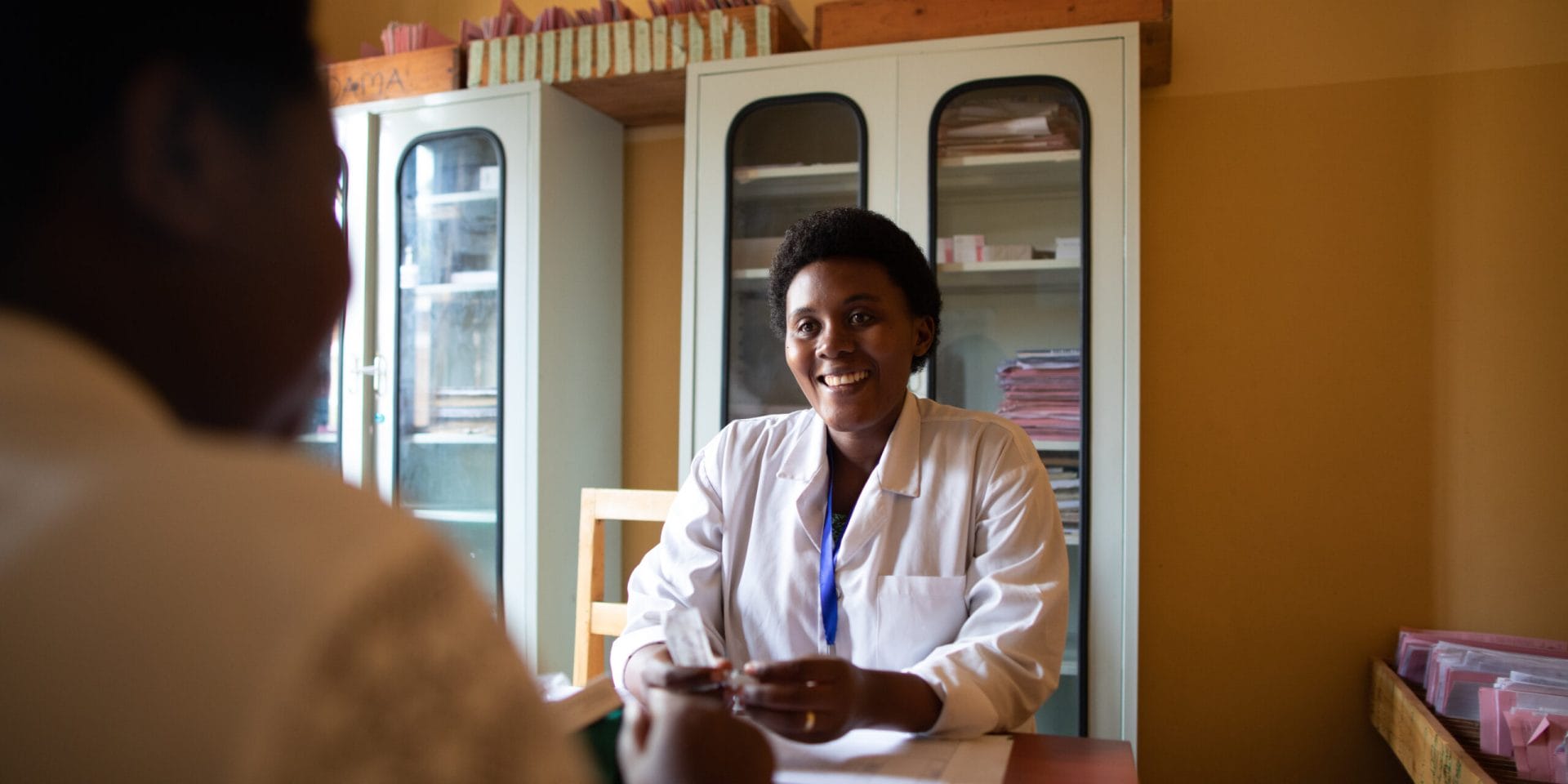 Doctor provides counseling service to patient in Rwanda.