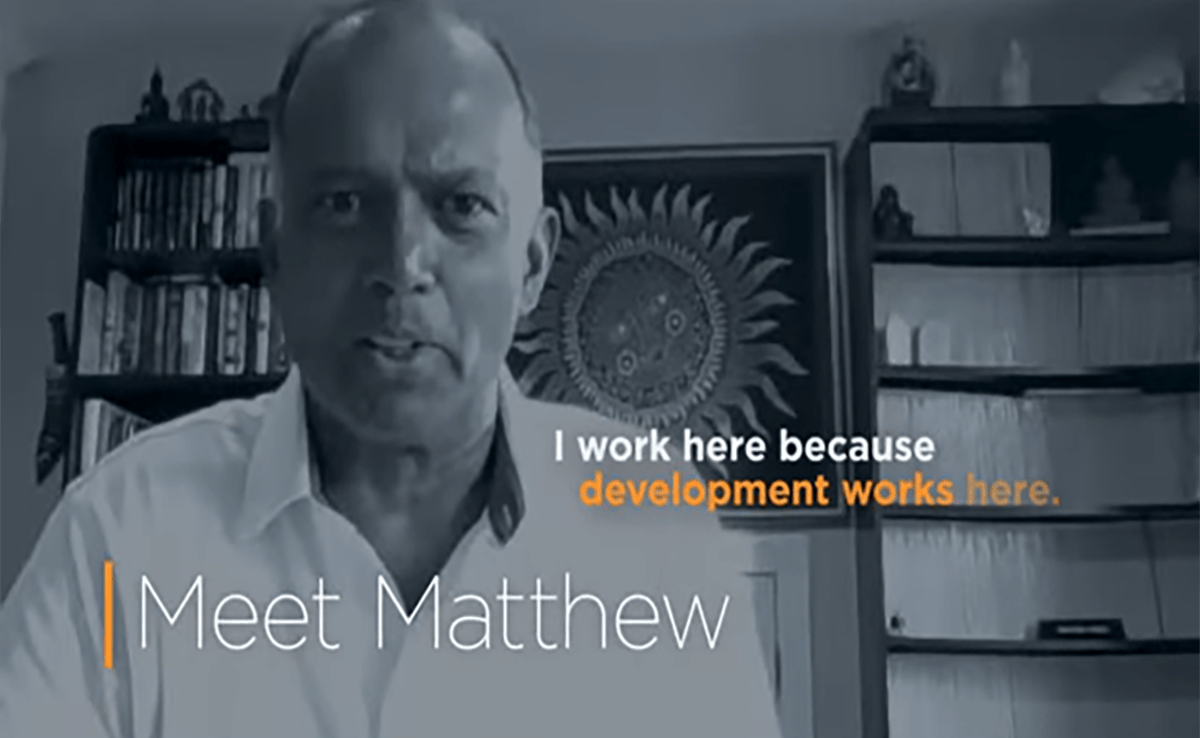 Image of a man speaking with overlaid text reading "Meet Matthew; I work here because development works here."